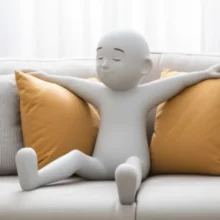 A-person-relaxing-on-a-couch,-gently-stretching-their-legs,-showing-relief-from-discomfort.